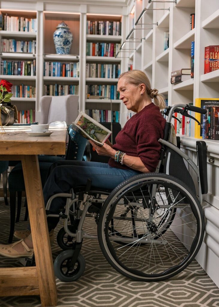 Image of woman in wheelchair reading | Angela Griffith Law